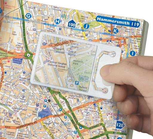 translucent credit card sized magnifier over a map